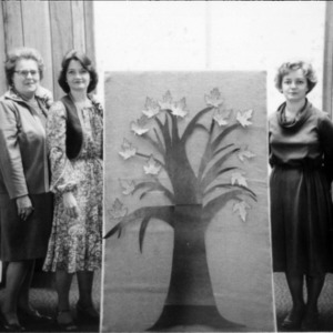 Group of women with illustration of a tree