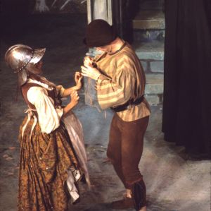 Two people enacting a scene on stage