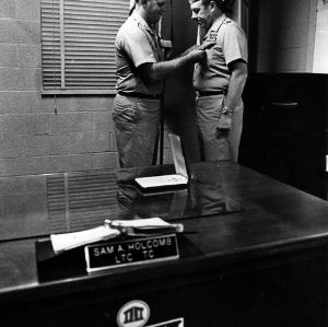 Sam A. Holcomb and other ROTC man in office
