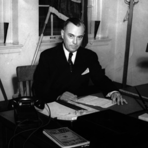 Lieutenant Colonel J. L. T. Lancaster at desk
