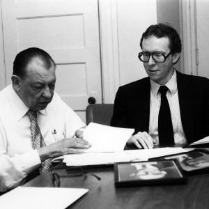 Selz C. Mayo and Ronald Wimberley examining documents