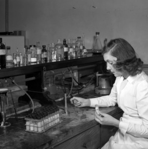 J. L. Moore in lab