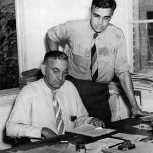W. F. Morris and Arnold Peterson in office