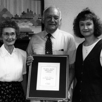 Donald E. Moreland with wife Verdie Moreland, their daughter, and certificate