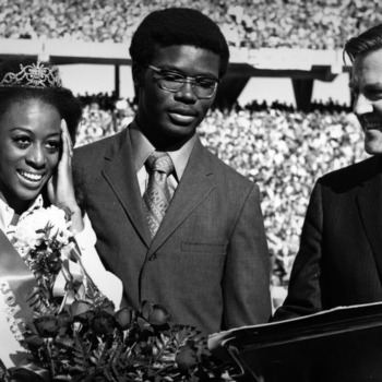 Homecoming Queen Mary Evelyn Porterfield with escort Michael Brown and Alumni Affairs director Bryce Younts