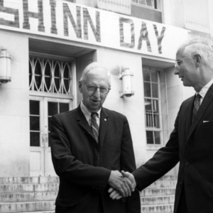 William Edward Shinn shaking hands with other, at "Ed Shinn Day" celebrations
