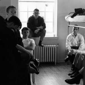 Students talking in a dorm room
