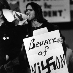 Student with "Beware of Nixon" sign