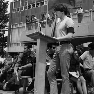 Student giving speech by a podium