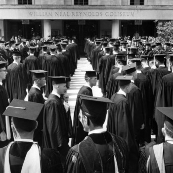 Students at graduation outside Reynolds Coliseum