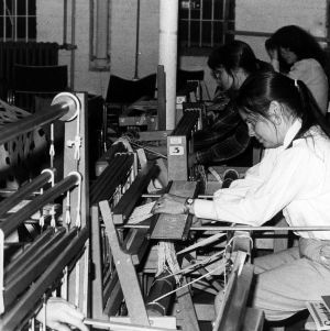 Students working in weaving class