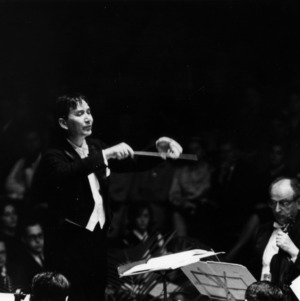 Conductor leading an orchestra