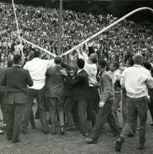 North Carolina State University crowd pulling down the goal post after a victory
