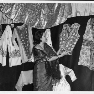 Woman in sari looking at other clothes