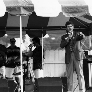 Speaker and band at a NC State Alumni Association tailgate event, 1990s