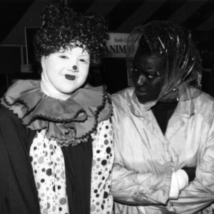 Clown and woman at a NC State Alumni Association tailgate event, 1990s