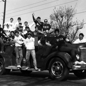 Pi Kappa Alpha fraternity members in Homecoming Parade