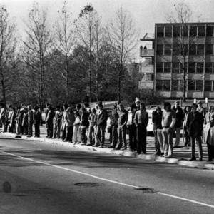 Crowd watching homecoming parade, 1976