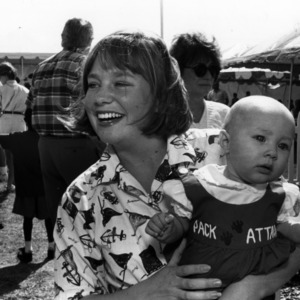 Chancellor's Circle Weekend, alumni tailgate event, mother and child, 1990s