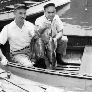 Men in boat with fish they caught
