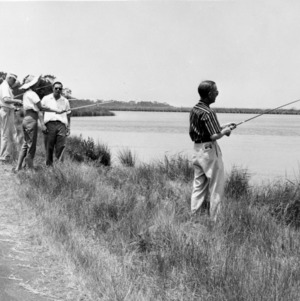 Group fishing along bank