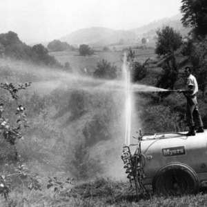 Man spraying fruit groves