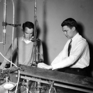 Chemical Engineering students with lab equipment