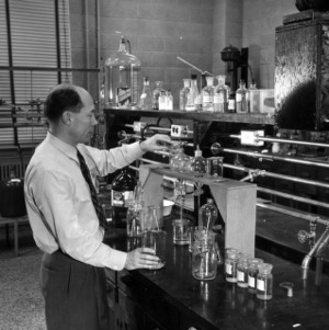 Dr. Russell F. Hazelton testing liquid seaps