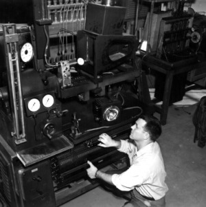 J. W. Humphreys showing equipment set up for study of influence of fuel properties on spray formation