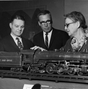 Ralph E. Fadum and others examining model train