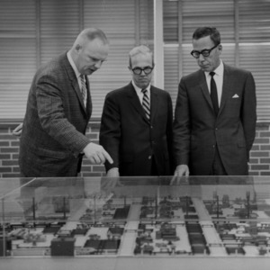 Ralph E. Fadum and others examining city model