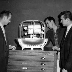 Dr. Pat McDonald, Dr. E. Gukley, and other examining equipment