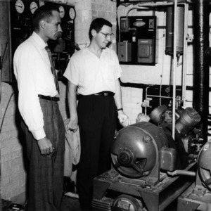 King R. Brose and Bob Rozett inspecting Cold Room refrigerator system