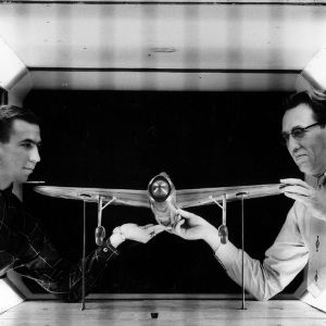 Robert M. Pinkerton and Mechanical Engineering student with plane and wind tunnel simulation