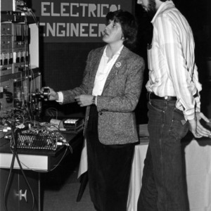 two people at College of Engineering electrical engineering display presentation
