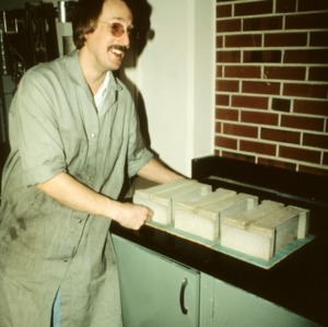 man with fired items from the College of Engineering laboratory kiln