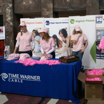 Handing out pink gear for the Hoops for Hope game