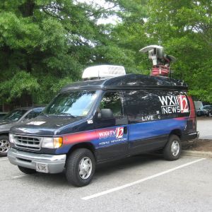 TV vans outside Reynolds Coliseum for Barack Obama's visit