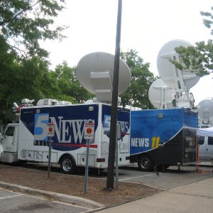 TV vans outside Reynolds Coliseum for Barack Obama's visit