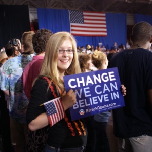 Girl holding a Barack Obama campaign sign