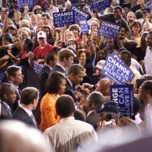 Barack Obama and his wife Michelle walk through the crowd at a rally in Reynolds Coliseum