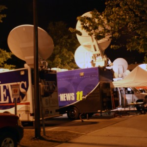 Media trucks outside after the Barack Obama rally