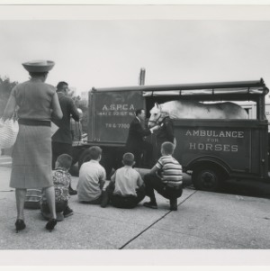 ASPCA photograph: Children watch interview with ASPCA Agent displaying horse and ambulance