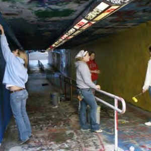 Students painting in the Free Expression Tunnel