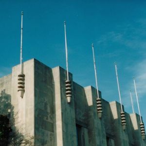 Flag poles atop Reynolds Coliseum