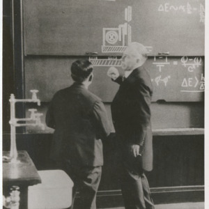 Dr. Yoshio Nishina with Dr. Niels Bohr as his interpreter