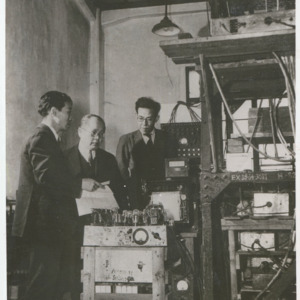 Dr. Yoshio Nishina at Itabashi Cosmic Ray Laboratory with two others