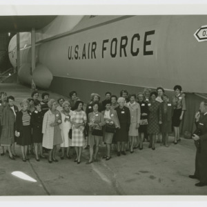 Photograph of women in front of US Air Force plane
