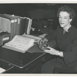 Photograph of Katharine Stinson at desk at CAA