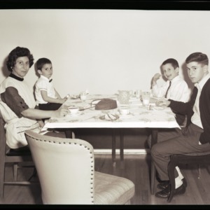 Johnny, Edward, Mary and Douglas Mattox at table with cake, January 27, 1964